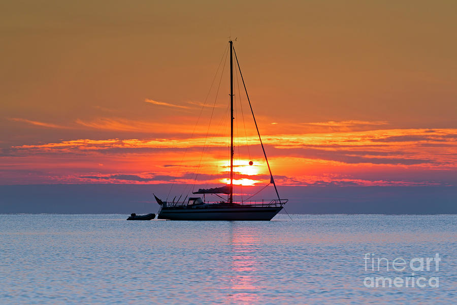 Anchored Sailing Boat At Sunset Photograph