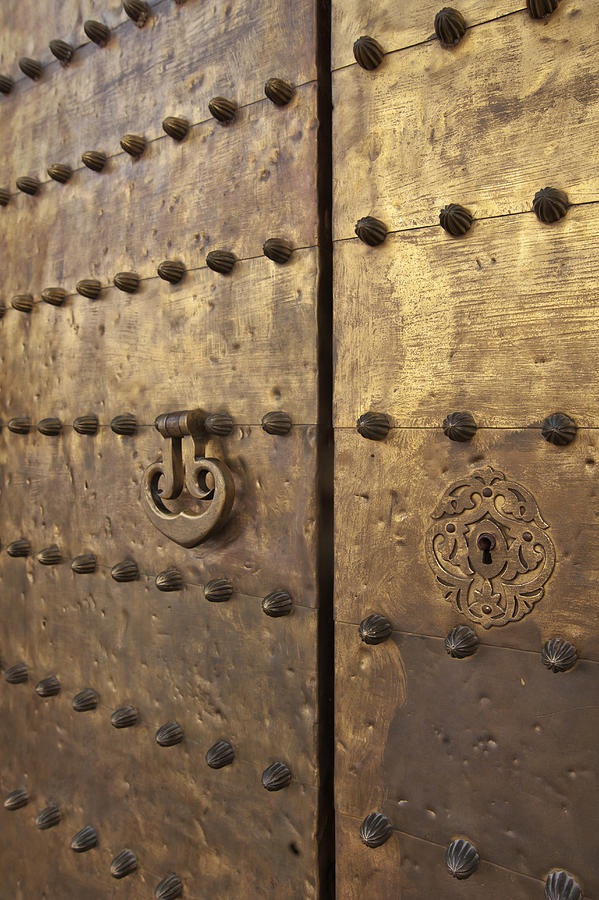 Ancient bronze door at Mezquita Photograph by Izzet Keribar