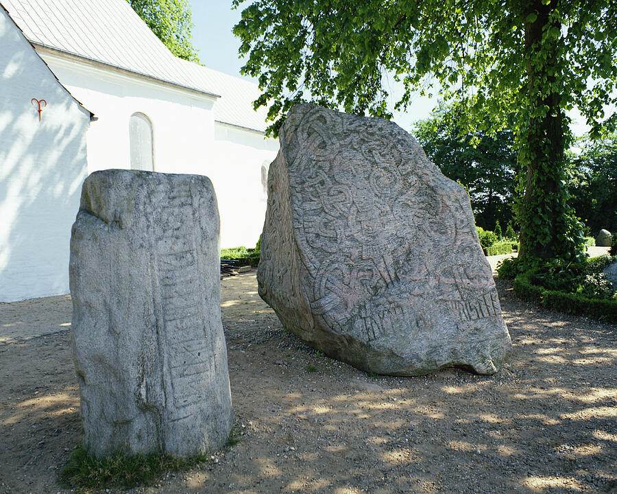 Ancient carvings on large rocks in Jelling Mounds, Denmark Photograph by Mixa