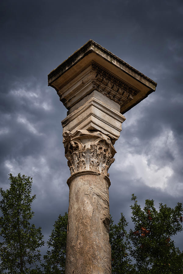 Ancient Corinthian Column And Stormy SKy Photograph by Artur Bogacki