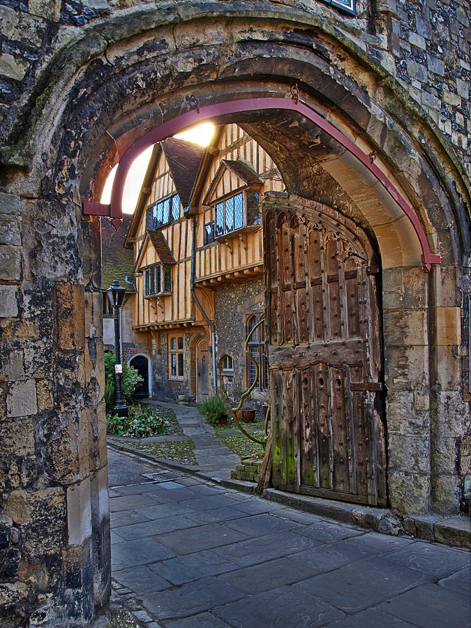 Ancient gate in city wall, with wooden gates Photograph by Neil Howard