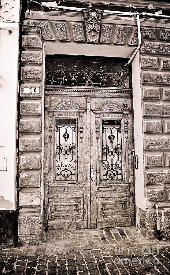 Ancient Wooden Door in Black and White Photograph by Ramona Matei
