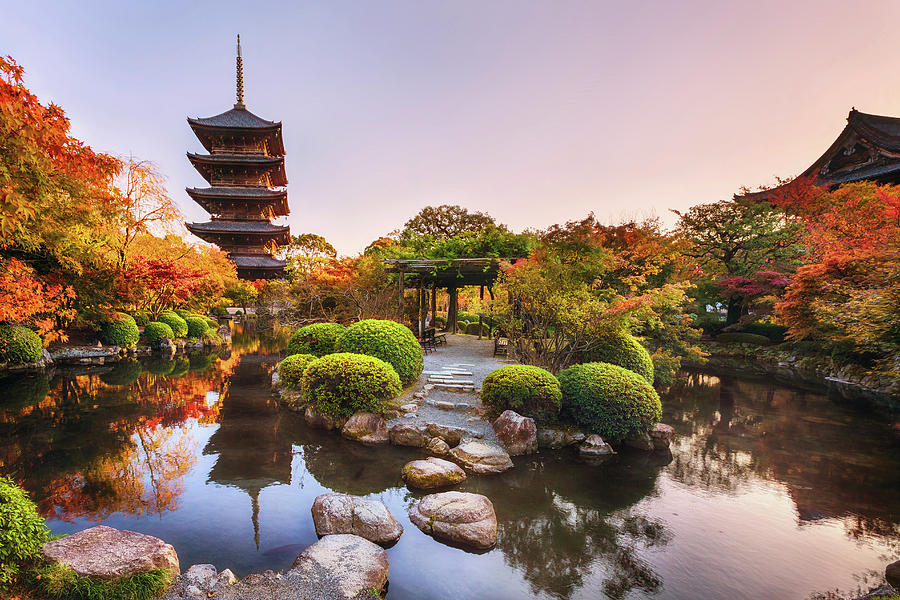 Ancient wooden pagoda Toji temple in autumn garden, Kyoto, Japan ...