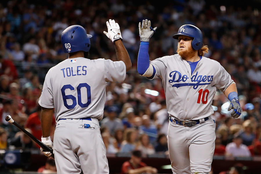 Andrew Toles and Justin Turner Photograph by Christian Petersen