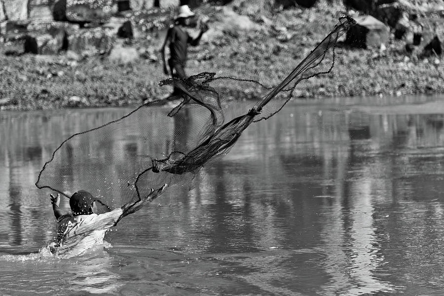  Angkor wats fisherman. Cambodia  Photograph by Lie Yim