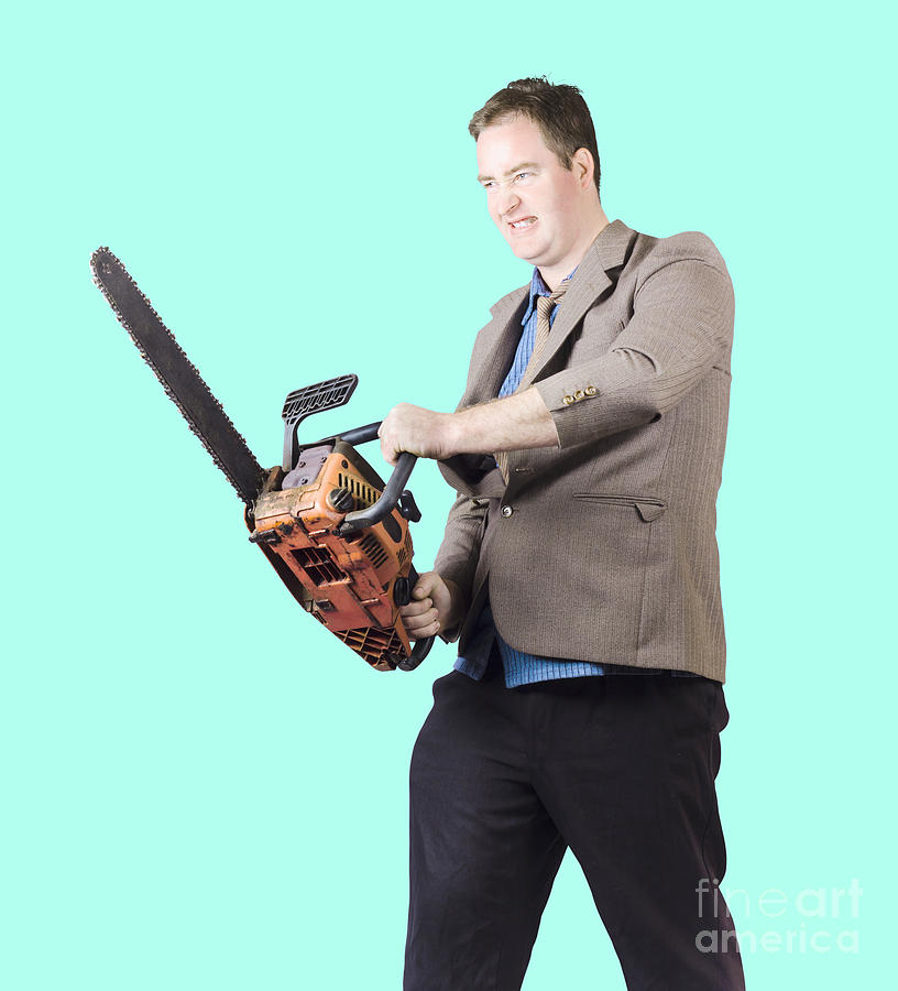 Angry man in business attire holding chainsaw Photograph by Jorgo Photography