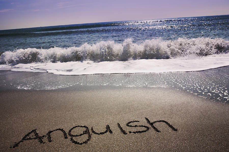 Anguish written in sand on beach Photograph by Hiroshi Watanabe