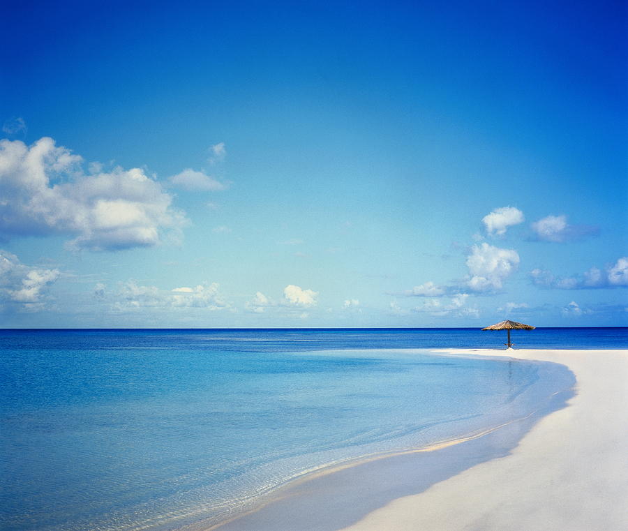 Antigua, Jumby Bay, umbrella on beach Photograph by Victoria Pearson