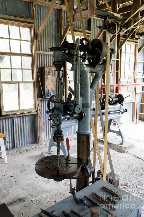 Antique, belt-driven power tools in the machine shop at the Kore Photograph by William Kuta