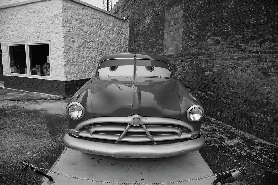 Antique car on Historic Route 66 in Galena Kansas in black and white Photograph by Eldon McGraw