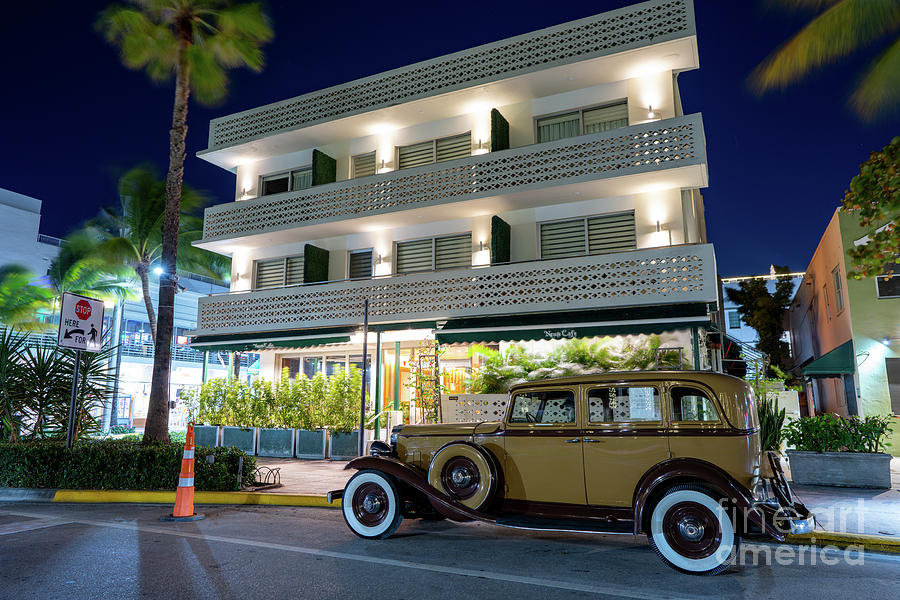 Antique car parked on Ocean Drive Miami Beach Photograph by Felix