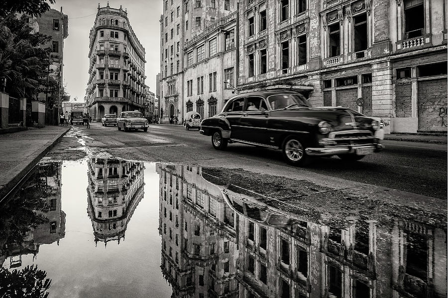 Antique cars and urban decay in Havana Photograph by Karel Miragaya