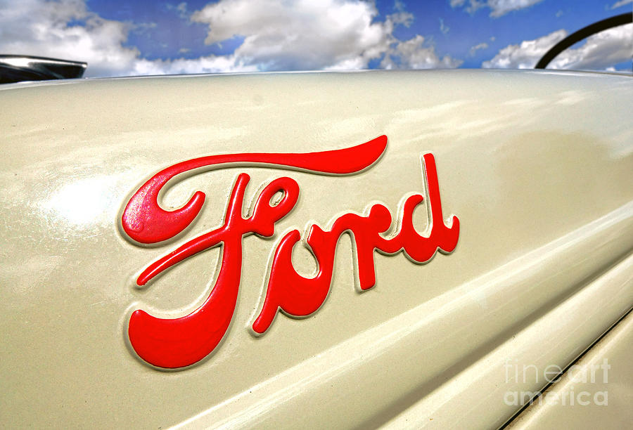 Antique Ford Tractor Logo Photograph by Olivier Le Queinec