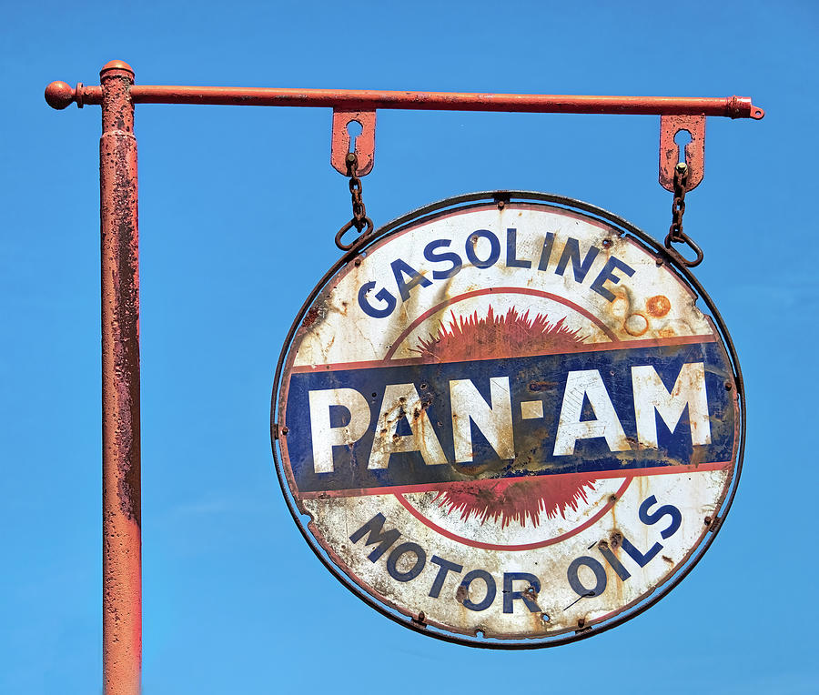 Antique Gasoline Sign On Blue Sky Photograph by Gary Slawsky
