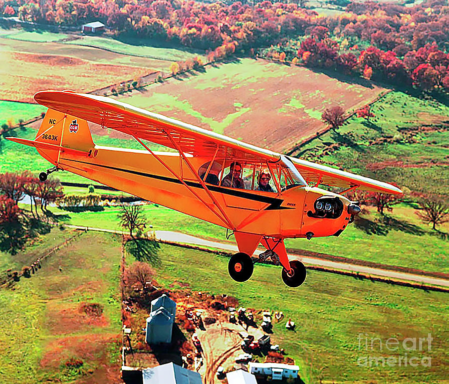 Antique Piper Cub  J3 over Bull Valley Farms Photograph by Tom Jelen