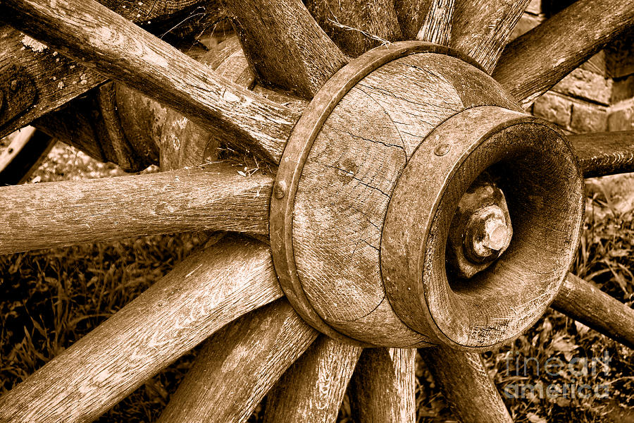 Antique Wagon Wheel - Sepia Photograph by Olivier Le Queinec