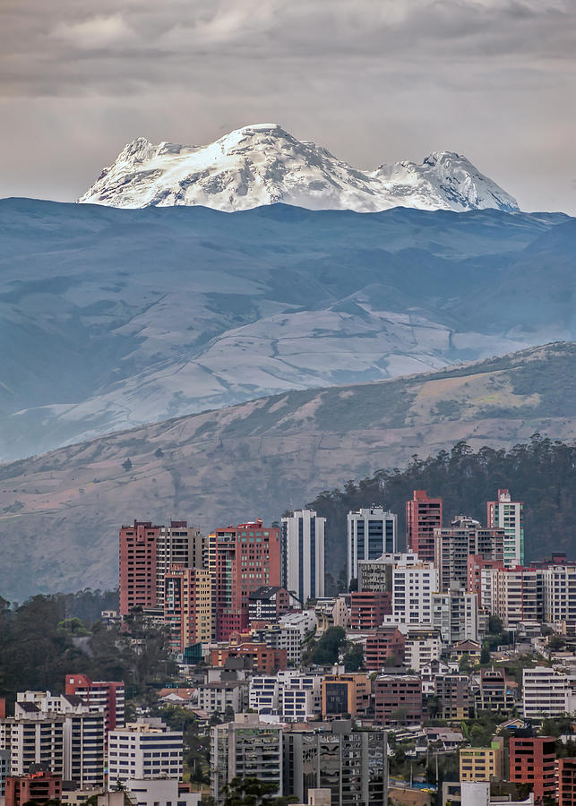 Antisana volcano and the modern city of Quito Photograph by Henri Leduc
