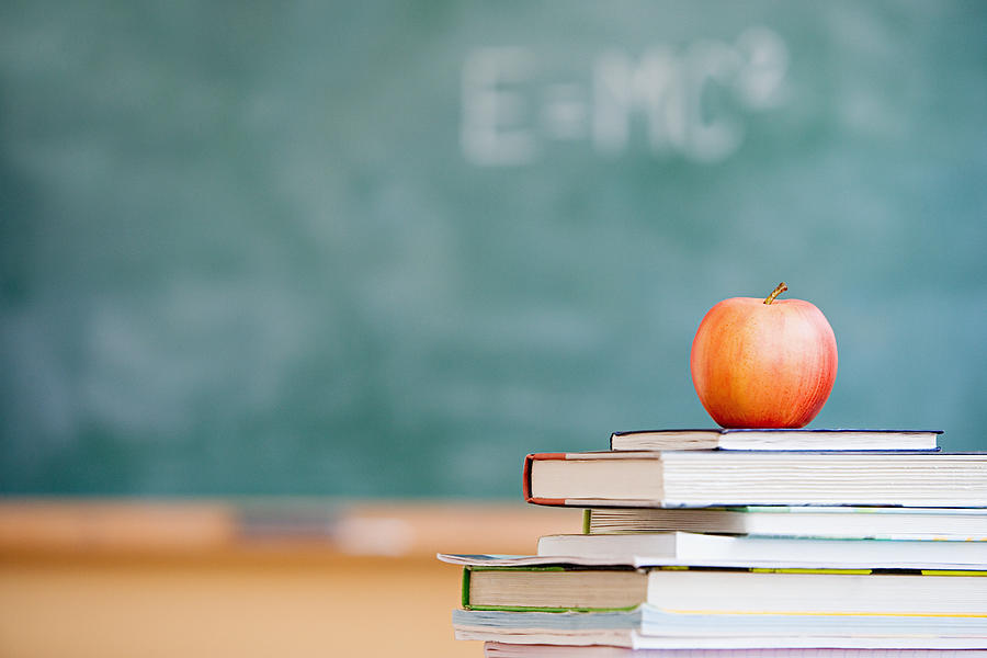 Apple in a classroom Photograph by Image Source