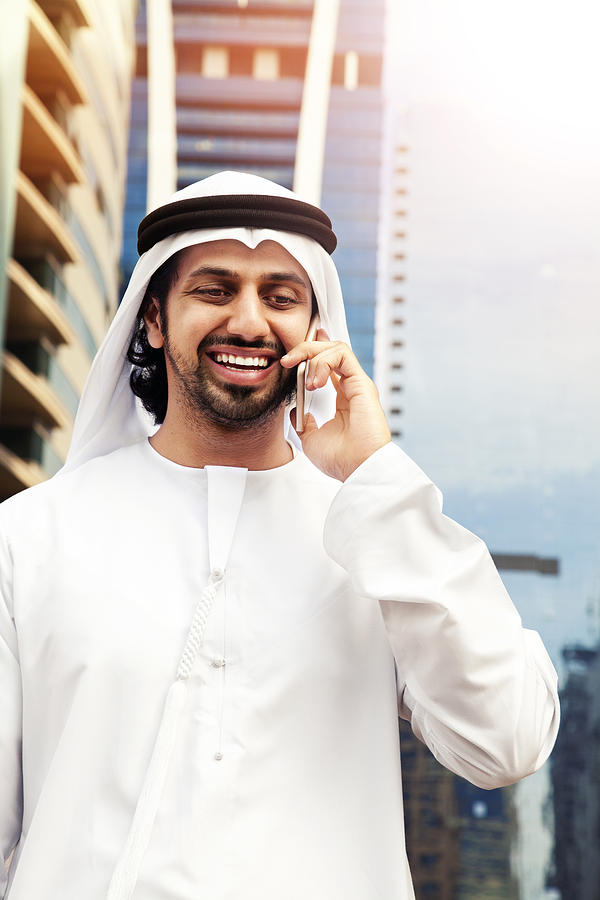 Arab business on the phone in Dubai. Photograph by Eli_asenova