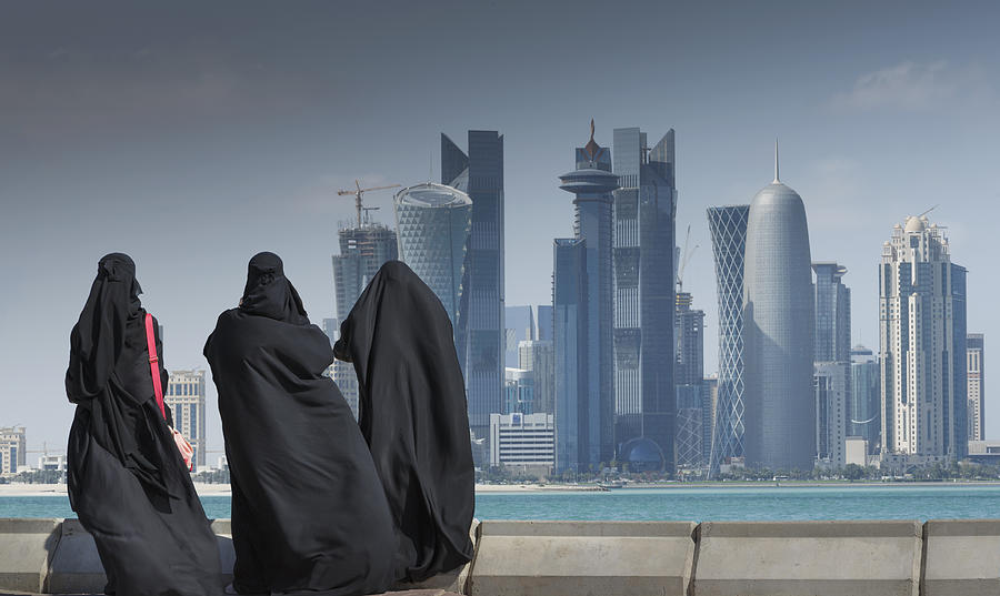 Arab women watching futuristic city Photograph by Buena Vista Images