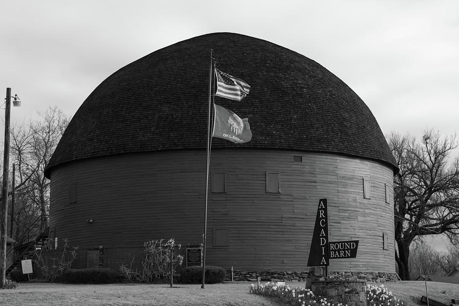 Arcadia Round Barn on Historic Route 66 in Arcadia Oklahoma in black and white Photograph by Eldon McGraw