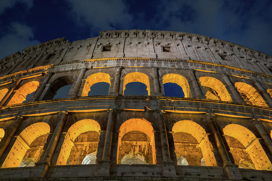 Arches of the Colosseum at Night Photograph by Artur Bogacki
