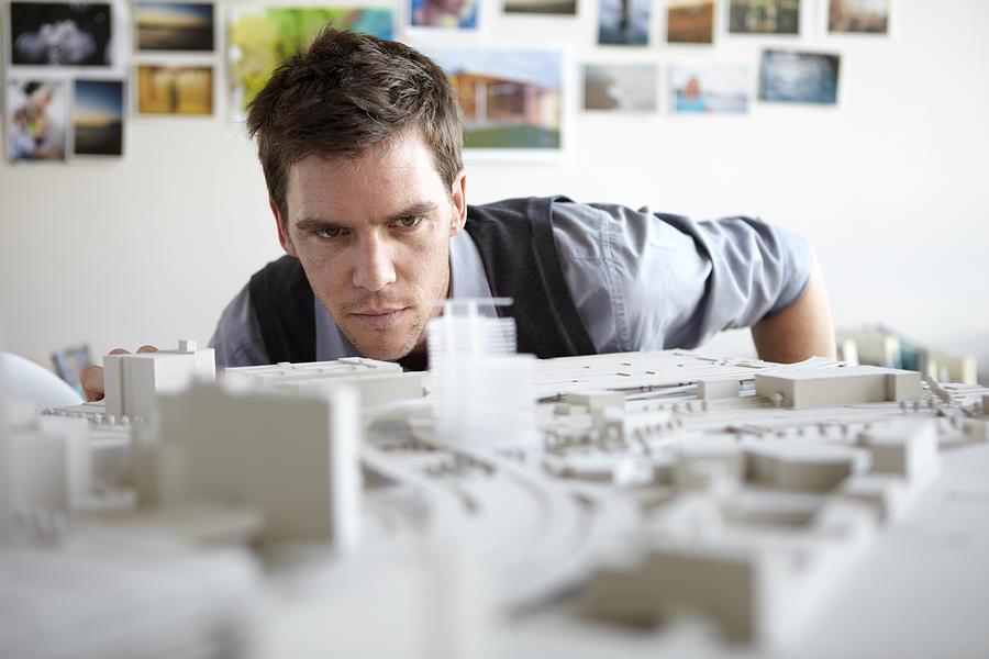 Architect studying model Photograph by Alistair Berg