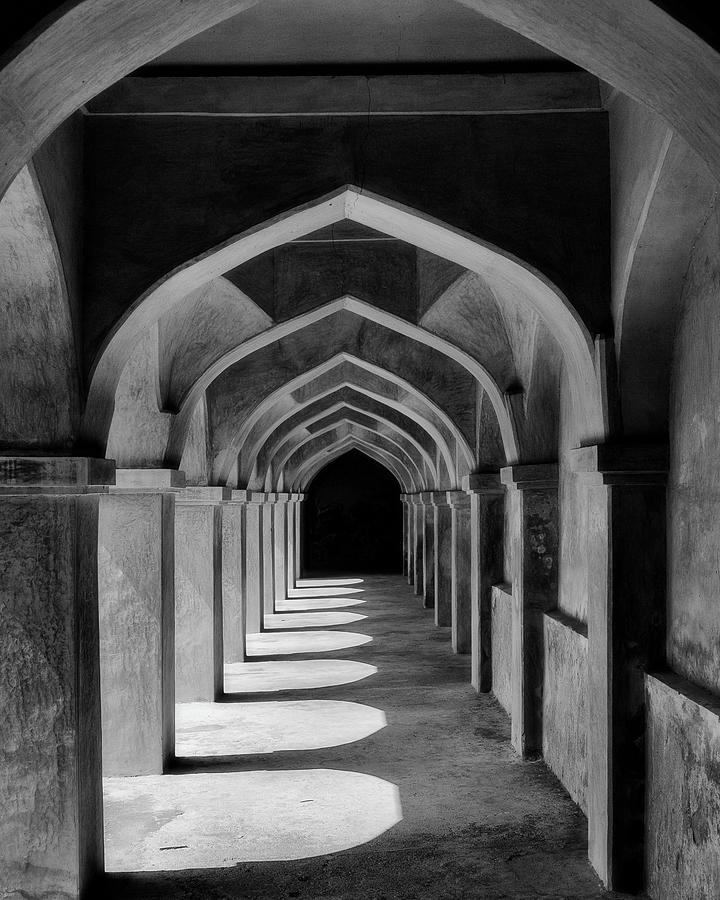 Archway in the shadows monochrome Photograph by Murray Rudd