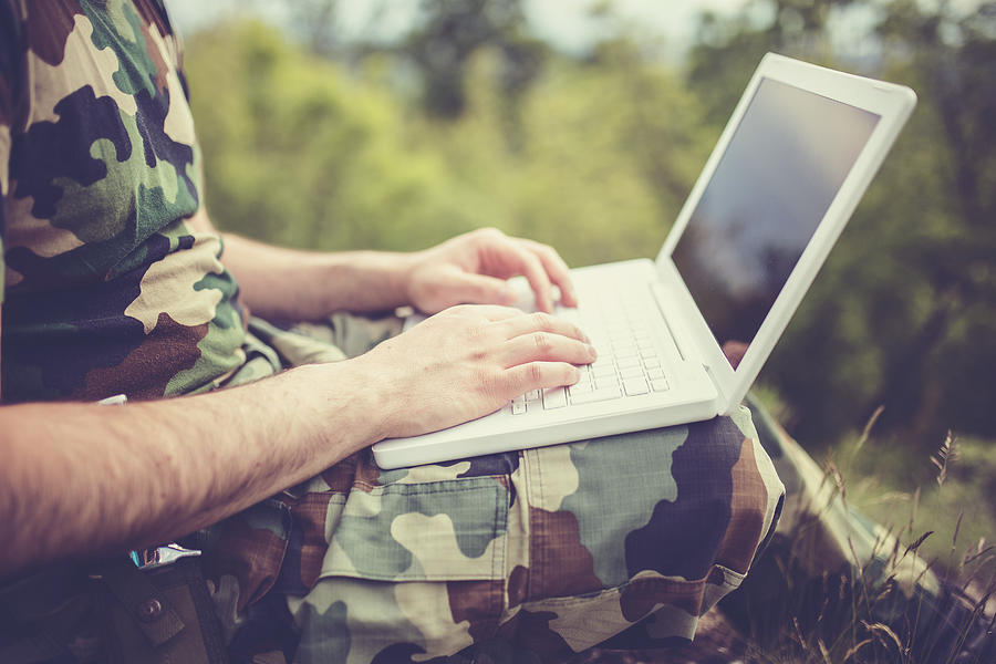 Army man working on laptop Photograph by South_agency