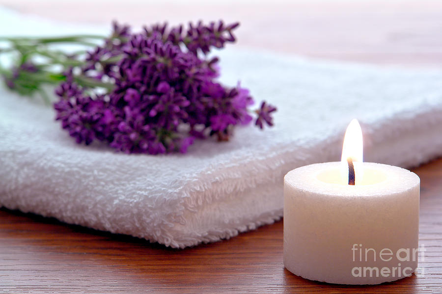 Aromatherapy Candle with Lavender Flowers on White Bath Towel in Photograph by Olivier Le Queinec