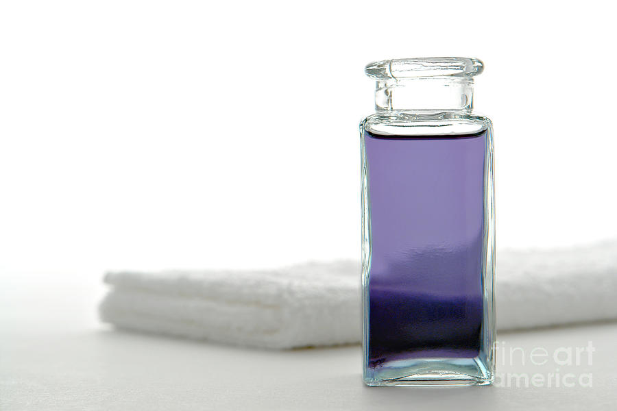 Bottle Photograph - Aromatherapy Essential Oil Bottle and Towel in a Spa by Olivier Le Queinec