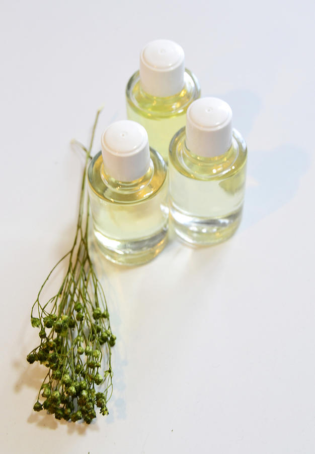 Aromatic oils on white background Photograph by Blanchi Costela