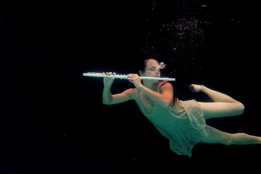 Artist magically floating with her flute 77 Photograph by Dan Friend
