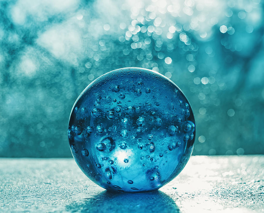 Artistic composition of blue glass ball with water drop Photograph by Oxygen