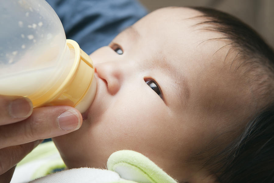 Asian Chinese Baby Feeding on Bottle CLose-up Photograph by YinYang