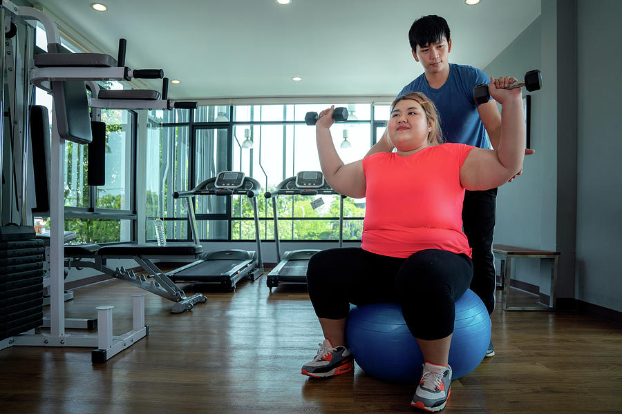 Asian Fat Girl Work Out And Weight Lifting On A Rubber Ball With