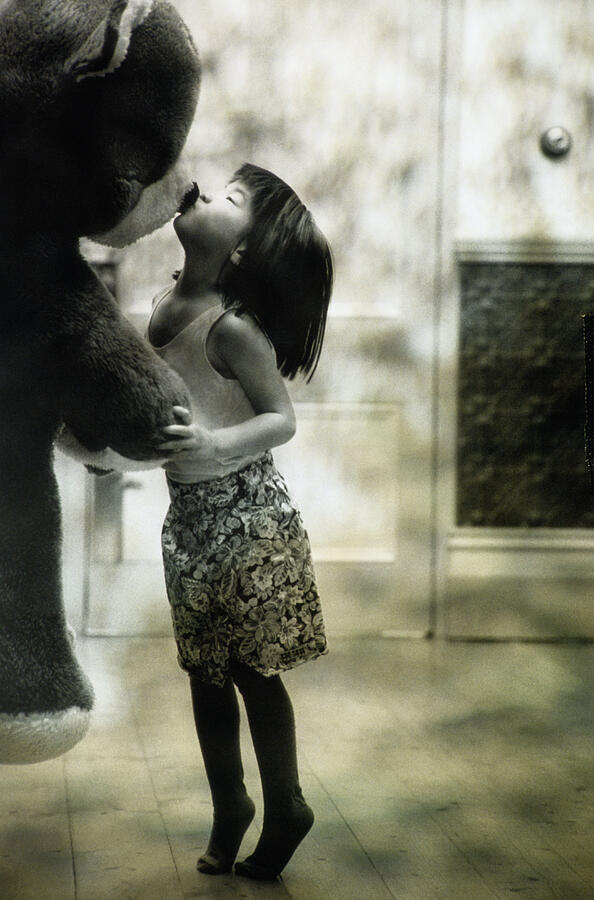 Asian Girl Kissing Big Stuffed Bear In Black And White Photograph by Tomek Sikora