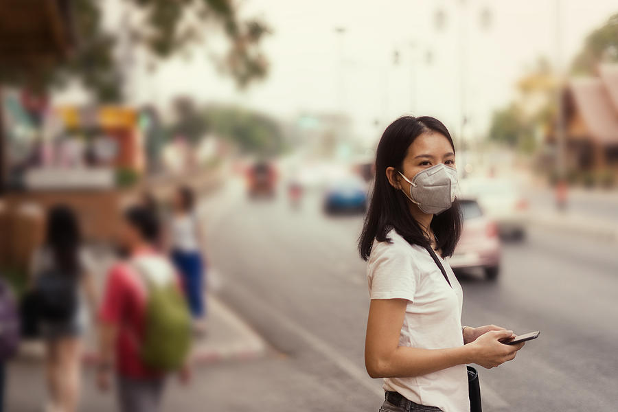 Asian Girl On Street And Wearing Pm 2.5 Mask For Safety From Air Pollution Photograph by Skaman306