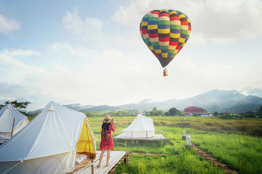 Asian girl take a hot air balloon photo by camera in Countryside Photograph by Anek Suwannaphoom