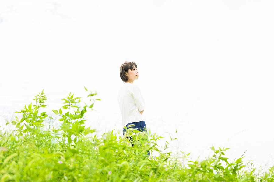 Asian girl with free atmosphere in the green field Photograph by Masafumi Nakanishi