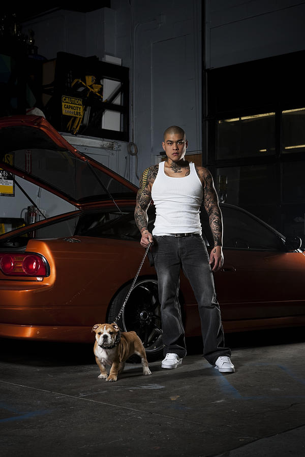 Asian Male with Bulldog, Tattoos, and Race Car, Copy Space Photograph by Quavondo