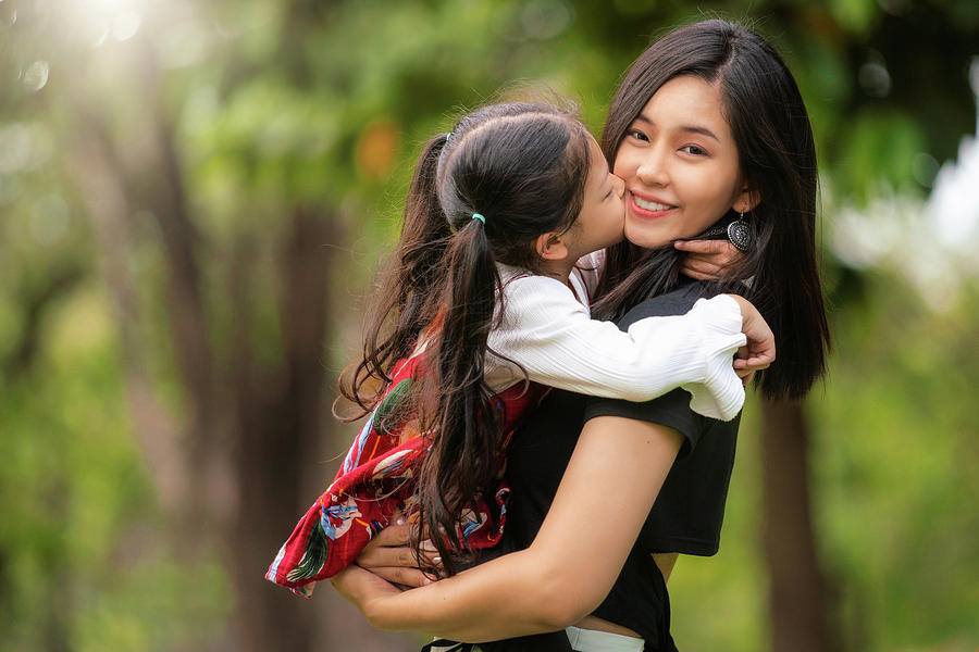 Asian Mom And Her Baby Kiss And Enjoy In Out Door Park Photograph B