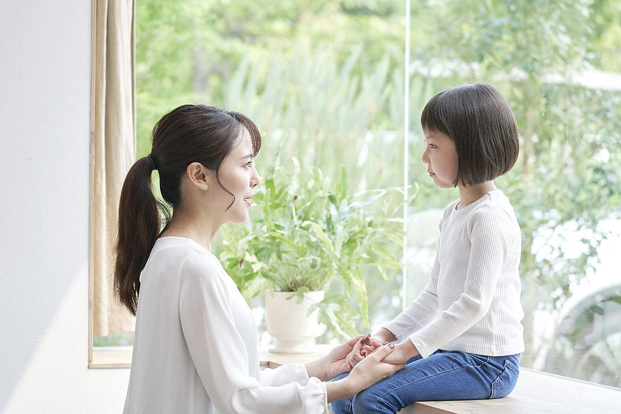 Asian mother talking with the daughter Photograph by Kokoroyuki
