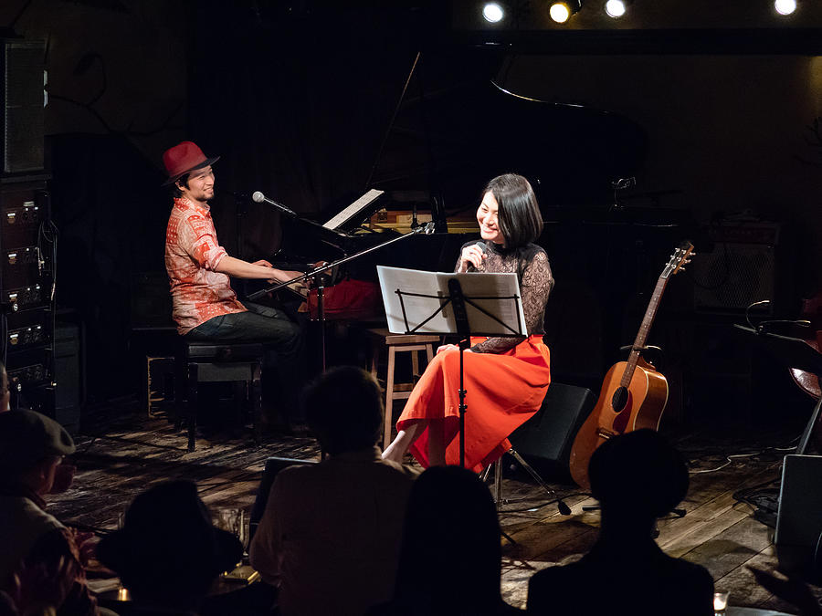 Asian musicians, pianist and guitarist, performing on stage Photograph by SetsukoN