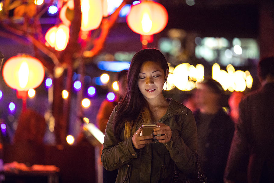 Asian woman at night in downtown Taipei - Taiwan Photograph by LeoPatrizi