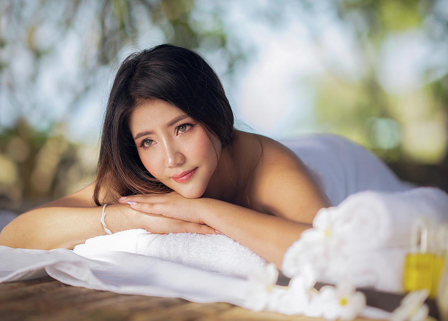 Asian woman relax with body spa in resort Photograph by Anek Suwannaphoom
