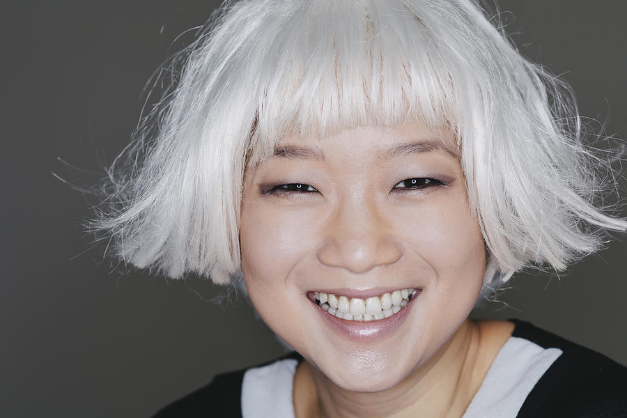Asian woman with platinum blond hair Photograph by Willie B. Thomas
