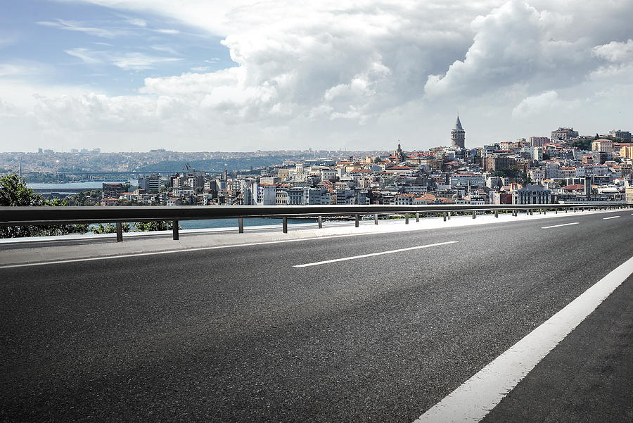 Asphalt road with Istanbul cityscape background. Photograph by Waitforlight