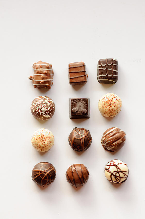 Assorted Chocolates arranged in a gird Photograph by Anshu