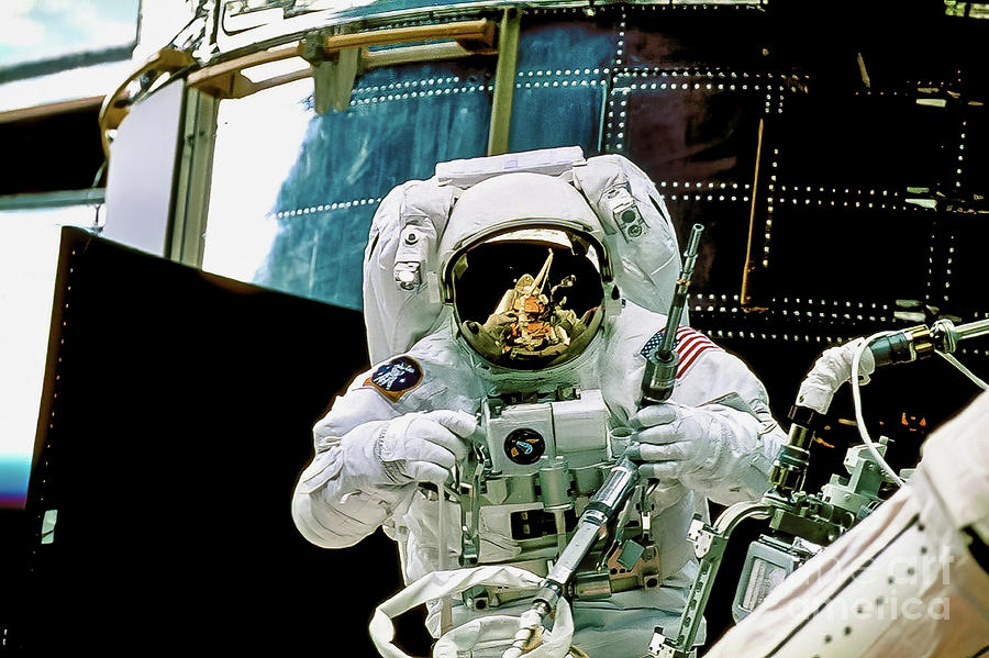 Astronaut Repairing Hubble Space Telescope Photograph by M G Whittingham